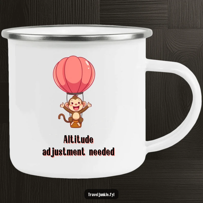 Funny camping mug showing an ecstatic monkey character bouncing on a hot air balloon, ready for any adventure.