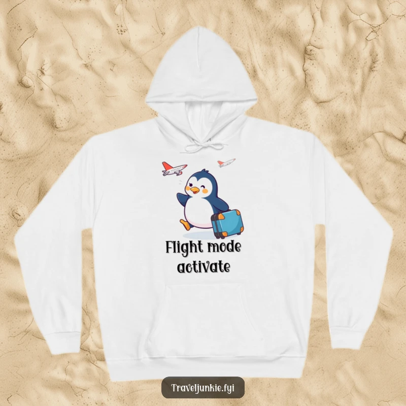 Funny happy penguin with suitcase, waddling towards a plane, depicted on a warm and comfortable hoodie.