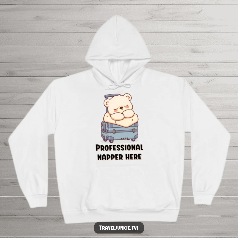 Funny sleepy bear cub bundled up, snoozing on a rolling suitcase, a warm and humorous hoodie for relaxation.