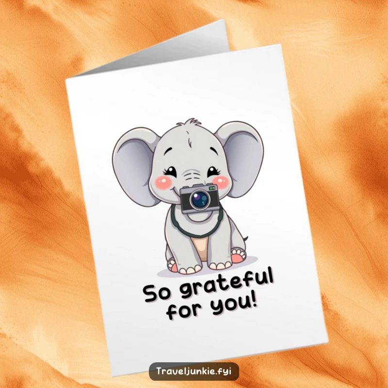 Funny Free Printable thank you card of a cheerful elephant with a camera around its neck posing for a photo, showing gratitude.