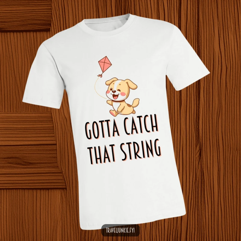 Funny T-Shirt: A happy, energetic dog leaps joyfully, chasing a soaring kite in a whimsical design.