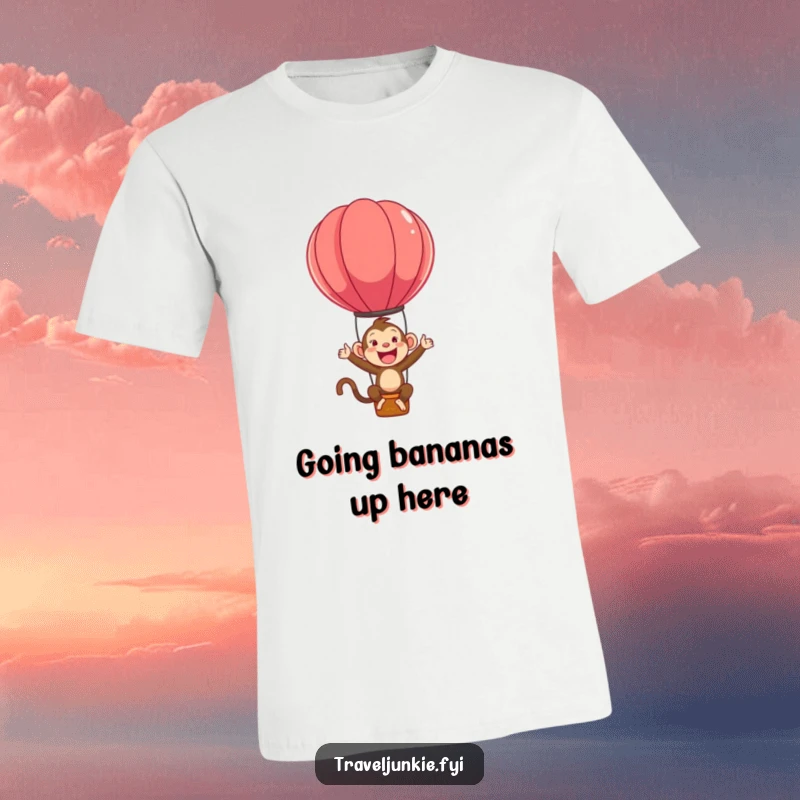 Funny t-shirt showcasing an ecstatic monkey character gleefully bouncing high above in a colorful hot air balloon.