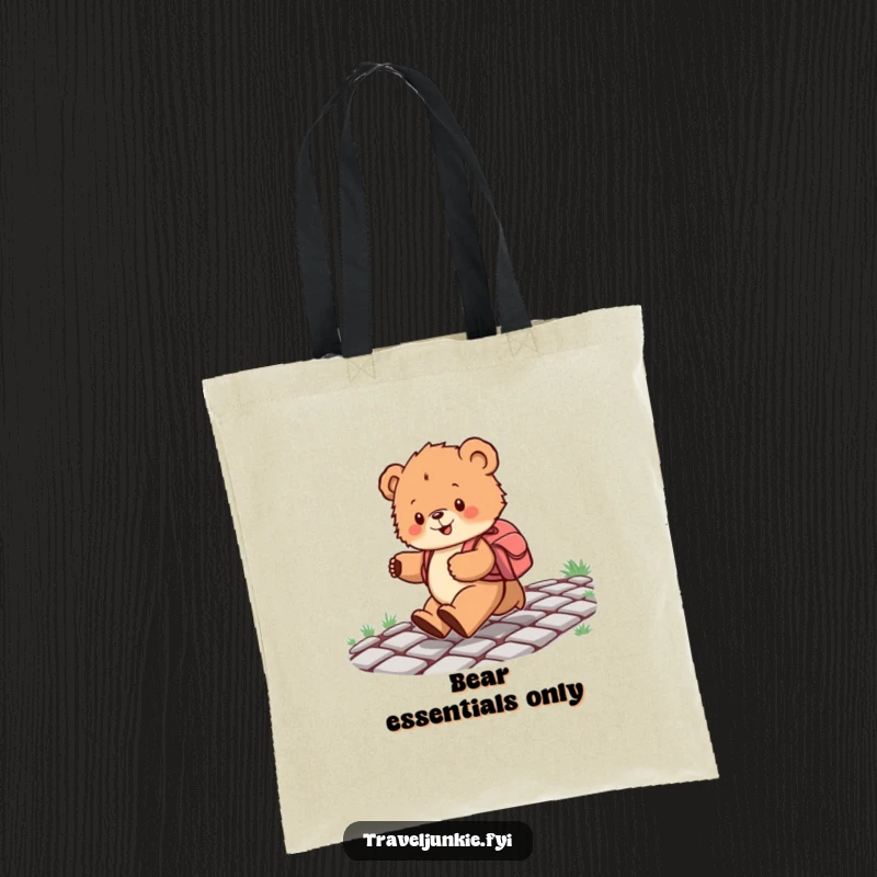 Funny tote bag illustrating a bear cub with a backpack skipping merrily down a cobblestone path, perfect for carrying items with a joyful theme.
