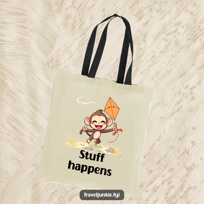 Funny monkey tote bag with a giggling character comically attempting to fly a kite on a windy day, perfect for daily use.